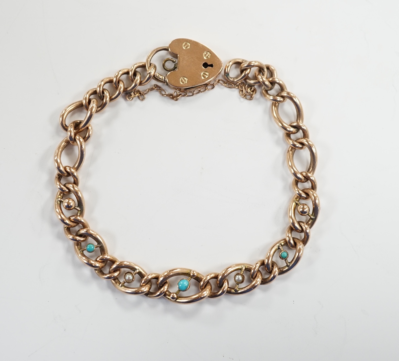 A 9ct gold and turquoise bead set curb link bracelet, with heart shape padlock clasp, 18cm, gross weight 11.2 grams.